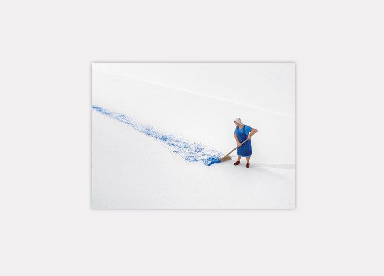Postal: Forced Labor III (Woman sweeping - Blue sand), (2017)